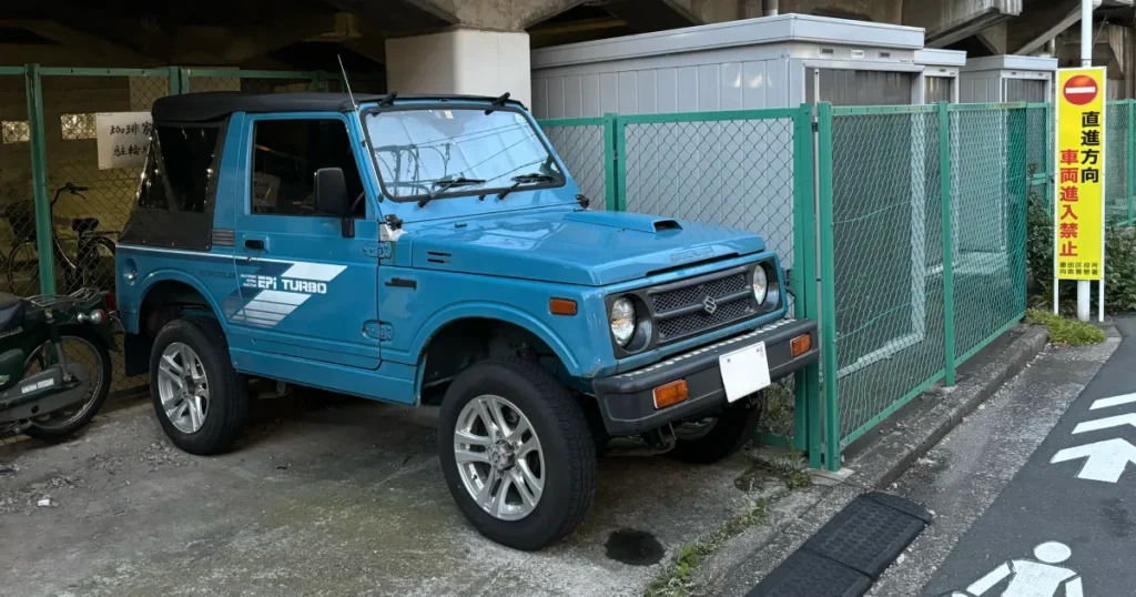 a classic Suzuki Jimny on the streets of Tokyo